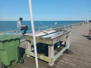 cleaning table at kure beach pier , nc